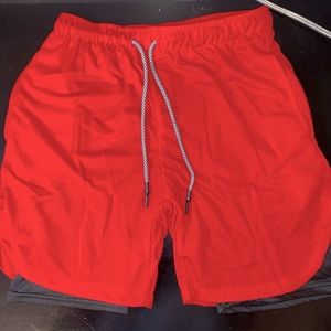 New men’s athletic shorts. Size medium in the color Red